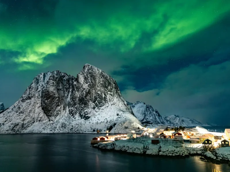 Aurora borealis Northern Lights over Norwegian sea at night — winter cruise experience for Indian travellers