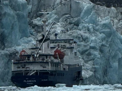 MV Plancius in front of an Arctic glacier in Svalbard