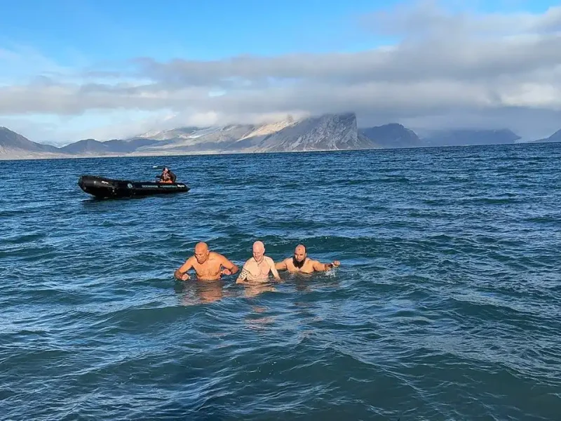Polar Plunge into Arctic water during a Svalbard expedition cruise