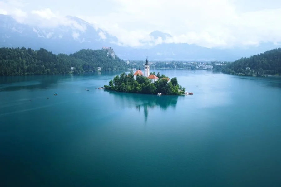Stunning aerial view of Lake Bled with the Church in 13 Days Balkans Package